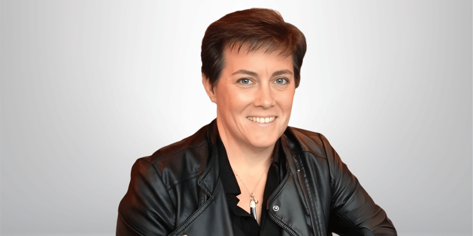 Marilyn Jenkins, founder of Law Marketing Zone®, smiling confidently in a leather jacket, promoting precision marketing for law firms.