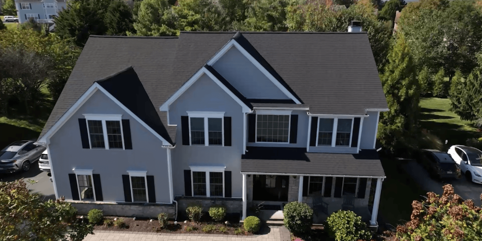 Aerial view of a well-maintained home, reflecting Pinnacle Roofing Experts' commitment to high-quality roofing and storm restoration services.