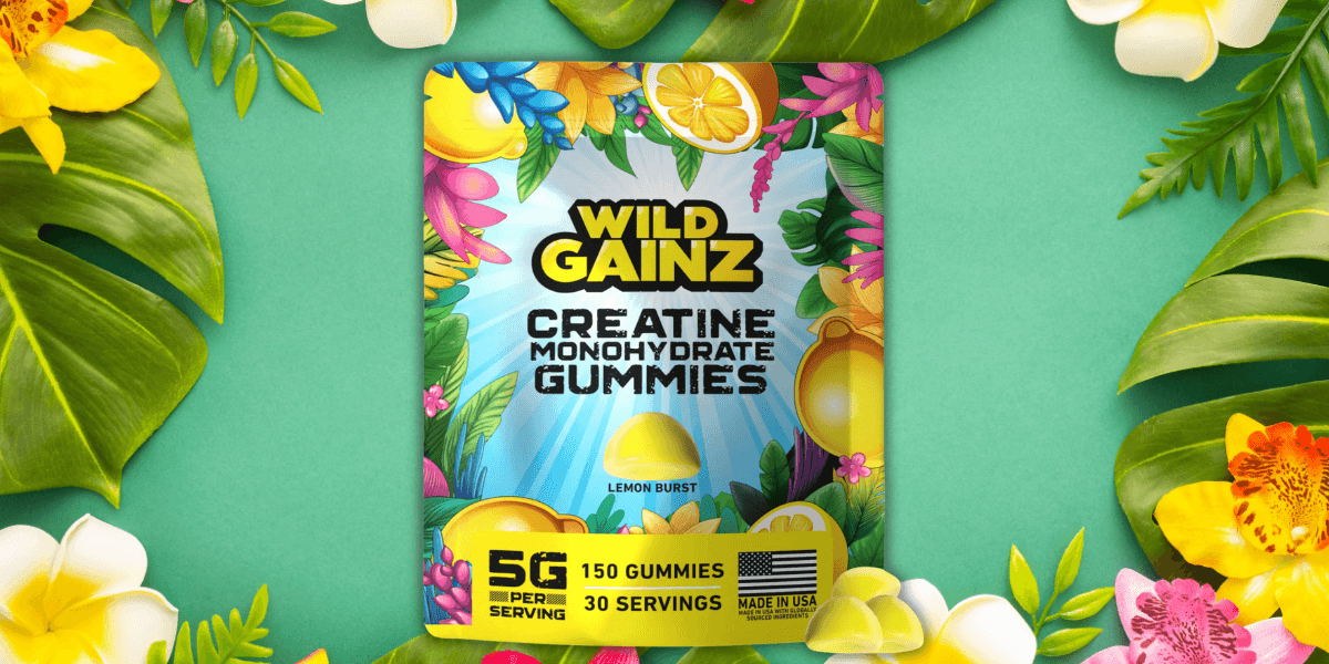 Wild Gainz Creatine Monohydrate Gummies package featuring vibrant tropical designs and a lemon burst flavor, set against a lush green background with flowers and tropical leaves, emphasizing the product's energy-boosting benefits.