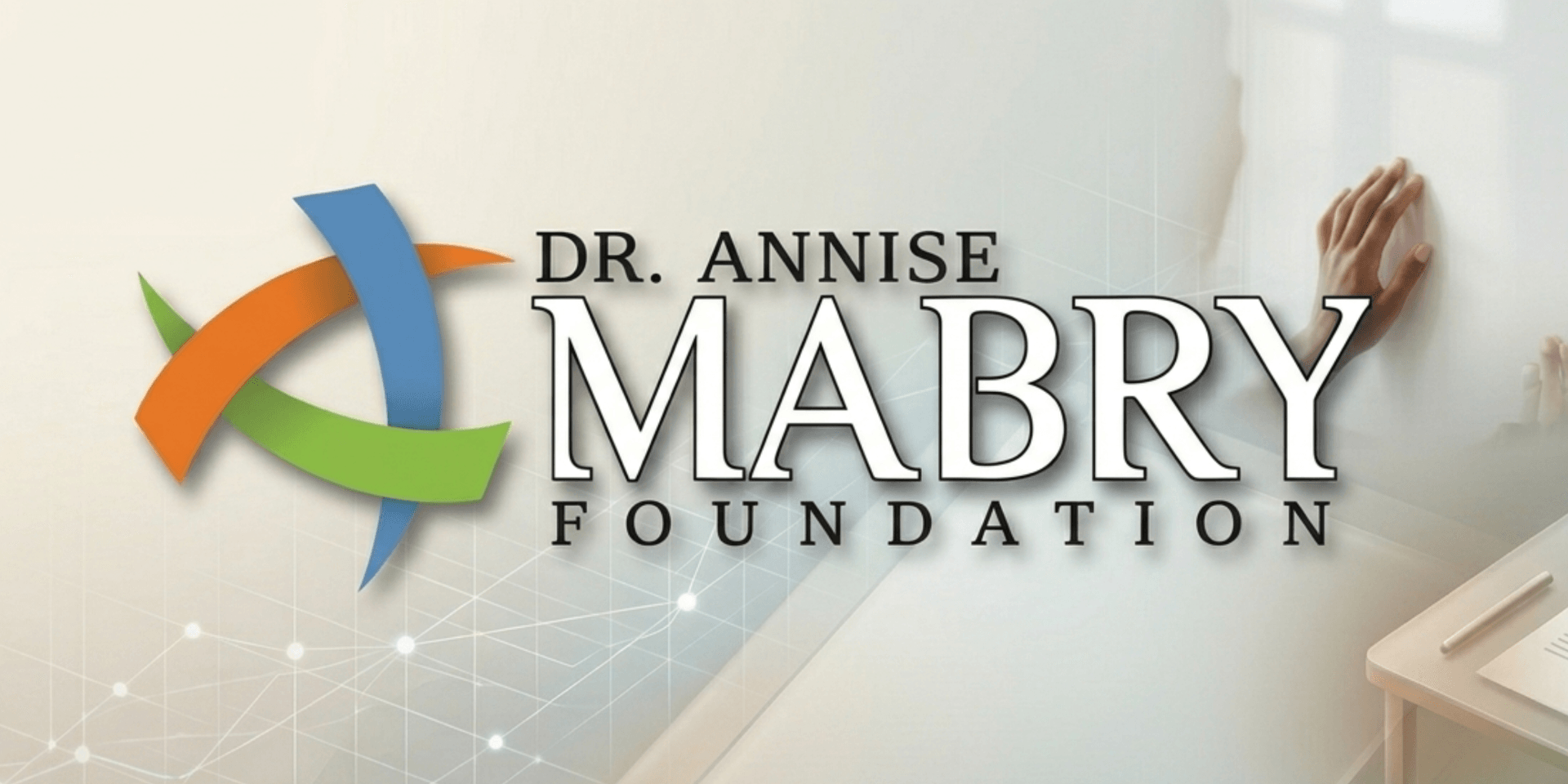 **Dr. Annise Mabry Foundation logo with abstract symbol and outstretched hand representing support and community impact.**