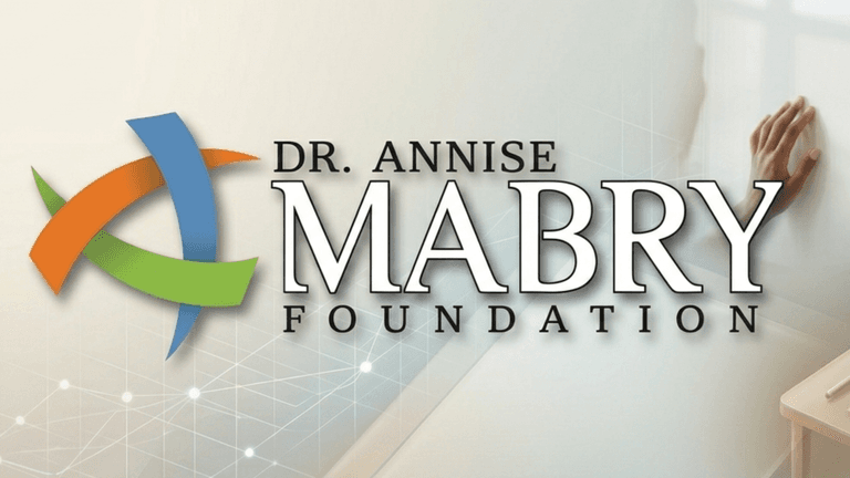 **Dr. Annise Mabry Foundation logo with abstract symbol and outstretched hand representing support and community impact.**